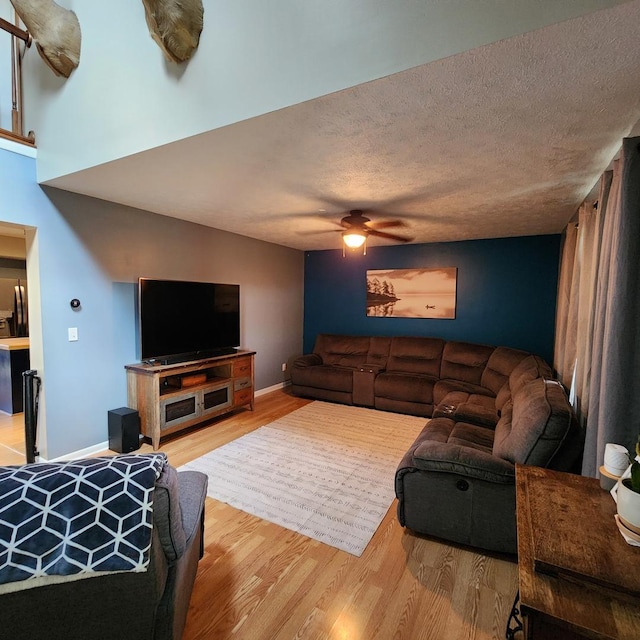 3883 E 2050th Rd, Serena, IL 60549 - living area featuring wood finished floors, ceiling fan, and a textured ceiling