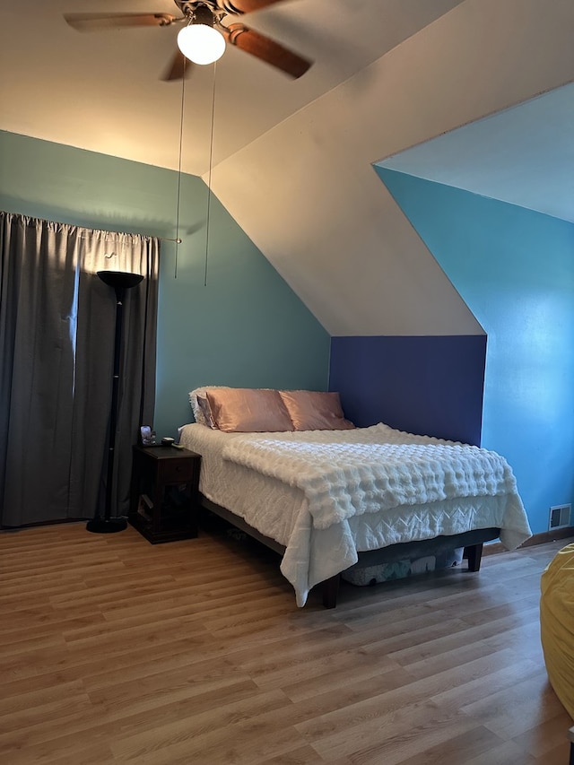 3883 E 2050th Rd, Serena, IL 60549 - bedroom featuring wood finished floors, vaulted ceiling, and a ceiling fan