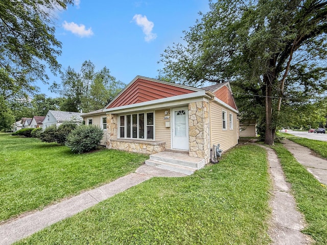16802 Anthony Ave, Hazel Crest, IL 60429 - bungalow-style house featuring stone siding and a front yard
