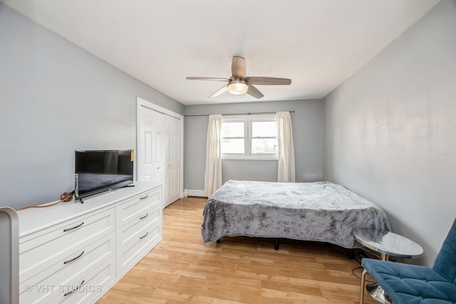 6255 S Mason Ave Unit 1B, Chicago, IL 60638 - bedroom featuring light wood-type flooring, ceiling fan, and a closet