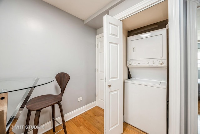 6255 S Mason Ave Unit 1B, Chicago, IL 60638 - washroom with stacked washer / drying machine and light wood-type flooring