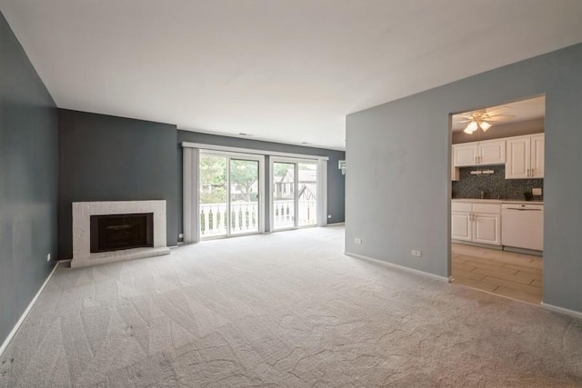 371 Southbury Ct Unit B2, Schaumburg, IL 60193 - unfurnished living room featuring light colored carpet, ceiling fan, and a brick fireplace