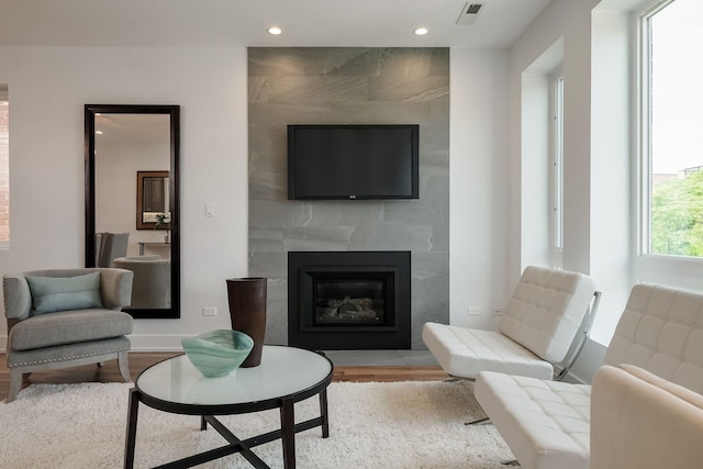 1415 W Walton St Unit 3, Chicago, IL 60642 - living room featuring wood finished floors, recessed lighting, and a tile fireplace