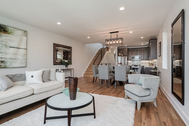 1415 W Walton St Unit 3, Chicago, IL 60642 - living room featuring stairway, light wood-style flooring, and recessed lighting