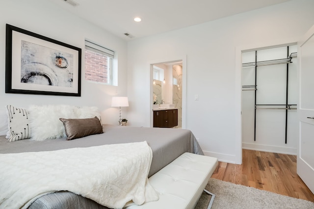 1415 W Walton St Unit 3, Chicago, IL 60642 - bedroom with light wood finished floors, recessed lighting, connected bathroom, and a closet