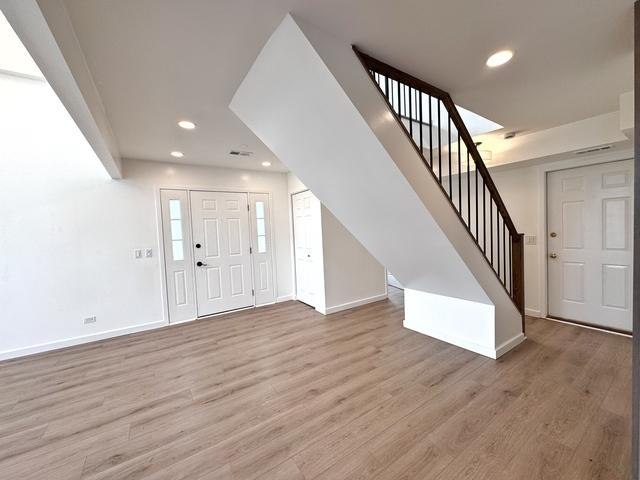 2326 Hamilton Pl, Schaumburg, IL 60194 - entryway featuring light wood-style flooring, stairs, and recessed lighting