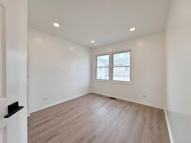 2326 Hamilton Pl, Schaumburg, IL 60194 - unfurnished room featuring light wood-style flooring and recessed lighting