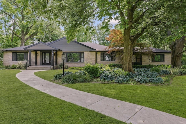 32 Greencroft Dr, Champaign, IL 61821 - mid-century inspired home featuring a front lawn