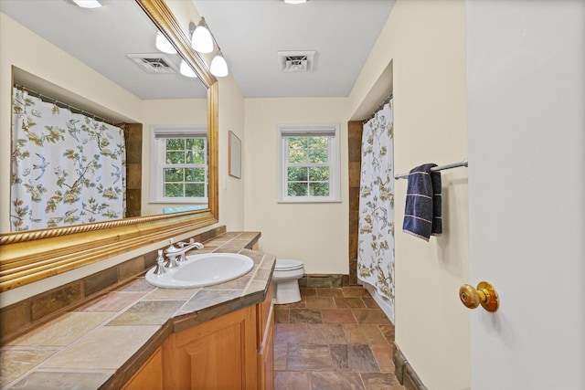 32 Greencroft Dr, Champaign, IL 61821 - full bathroom with vanity, stone finish floors, and curtained shower