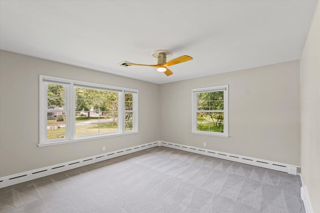 32 Greencroft Dr, Champaign, IL 61821 - carpeted empty room featuring ceiling fan and a baseboard heating unit