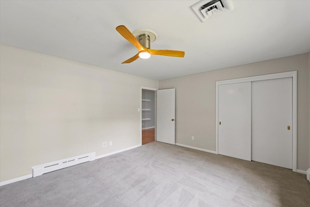 32 Greencroft Dr, Champaign, IL 61821 - unfurnished bedroom featuring a baseboard radiator, carpet flooring, a ceiling fan, and a closet