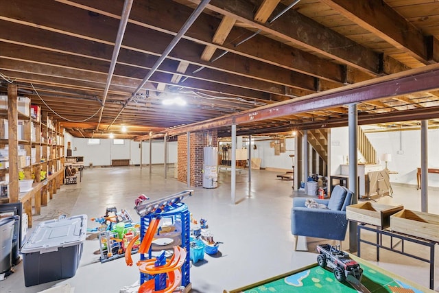 32 Greencroft Dr, Champaign, IL 61821 - unfinished below grade area featuring gas water heater and stairway