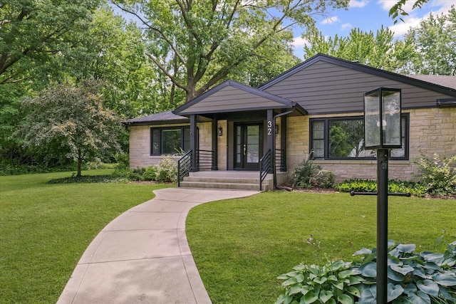 32 Greencroft Dr, Champaign, IL 61821 - view of front facade featuring stone siding and a front lawn