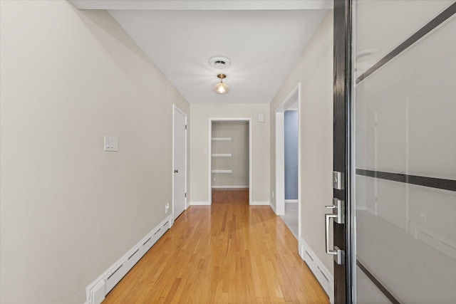 32 Greencroft Dr, Champaign, IL 61821 - hall with a baseboard heating unit and light wood-style floors