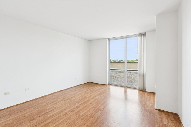 1640 Maple Ave Unit 503, Evanston, IL 60201 - empty room featuring wood finished floors and expansive windows