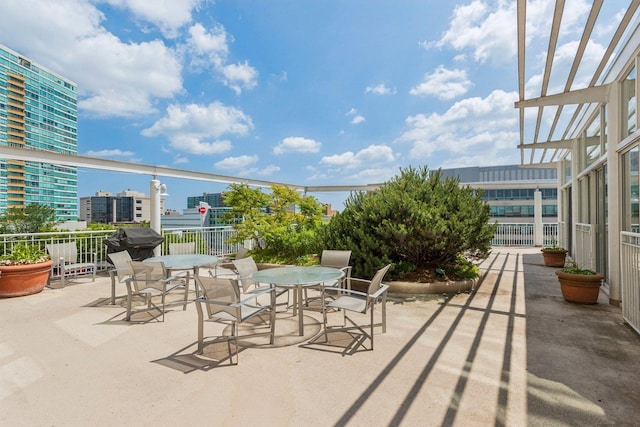 1640 Maple Ave Unit 503, Evanston, IL 60201 - view of patio featuring a city view and outdoor dining area