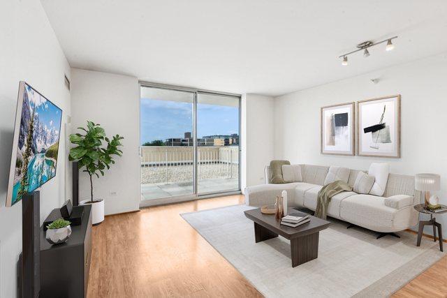 1640 Maple Ave Unit 503, Evanston, IL 60201 - living area with floor to ceiling windows and light wood finished floors