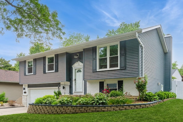 116 S Deerpath Dr, Vernon Hills, IL 60061 - bi-level home featuring a garage, brick siding, and driveway