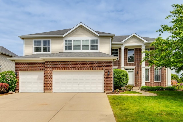 337A Veronica Cir, Bartlett, IL 60103 - view of front of home featuring driveway, an attached garage, a front yard, and brick siding