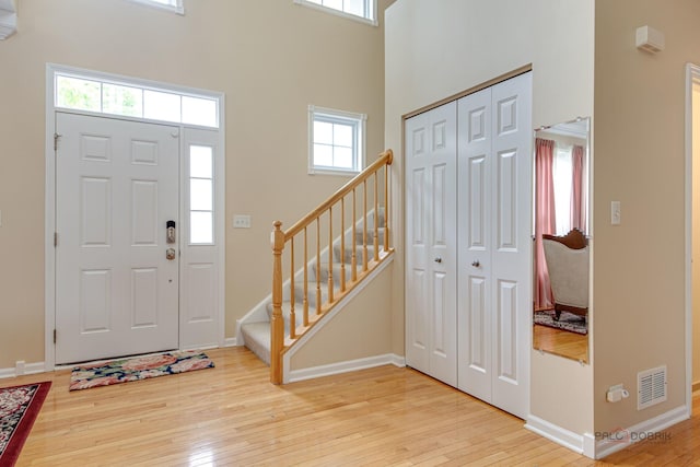337A Veronica Cir, Bartlett, IL 60103 - foyer entrance with light wood-type flooring, a high ceiling, and stairway