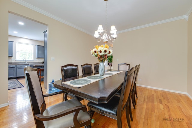 337A Veronica Cir, Bartlett, IL 60103 - dining area with light wood finished floors, a chandelier, and crown molding