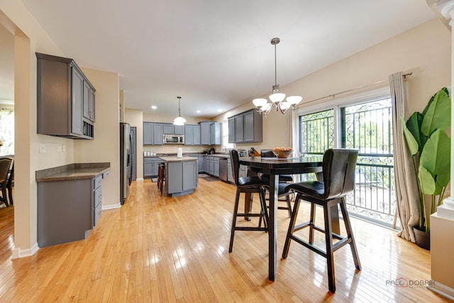 337A Veronica Cir, Bartlett, IL 60103 - dining room with light wood-style floors, a chandelier, and recessed lighting