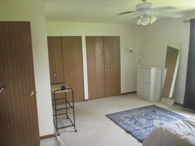 865 N Tamarac Blvd, Addison, IL 60101 - bedroom featuring multiple closets, light colored carpet, and a ceiling fan