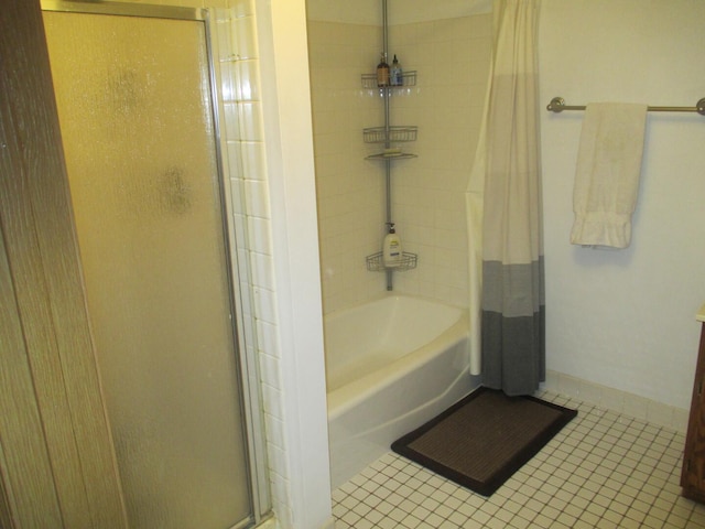 865 N Tamarac Blvd, Addison, IL 60101 - bathroom with tile patterned flooring and shower / tub combo