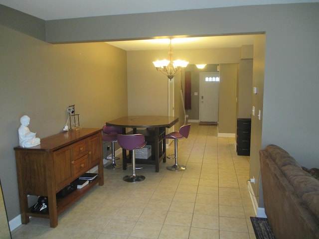 865 N Tamarac Blvd, Addison, IL 60101 - dining space featuring light tile patterned floors and a chandelier