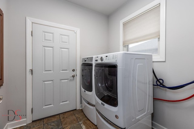 1661 Locust Rd, Morris, IL 60450 - washroom featuring washer and clothes dryer and dark stone finish floors