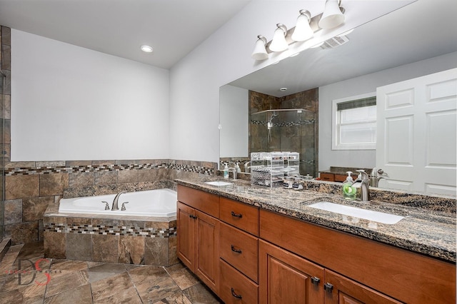 1661 Locust Rd, Morris, IL 60450 - full bath with a stall shower, double vanity, a garden tub, stone finish floors, and recessed lighting