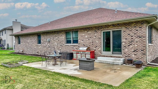 1661 Locust Rd, Morris, IL 60450 - rear view of property featuring brick siding, a yard, a patio area, roof with shingles, and entry steps