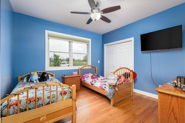 1661 Locust Rd, Morris, IL 60450 - bedroom with light wood finished floors, a closet, and a ceiling fan