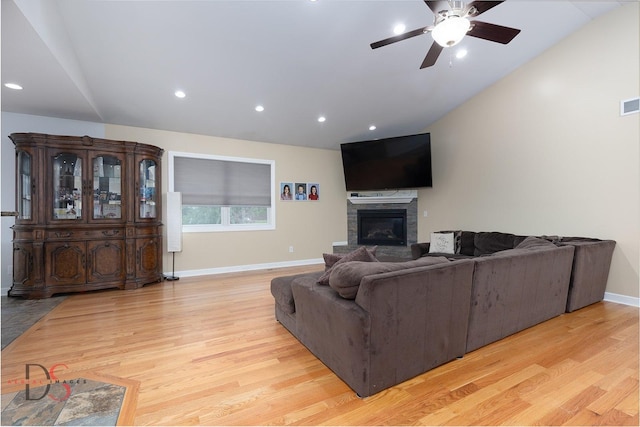 1661 Locust Rd, Morris, IL 60450 - living room featuring light wood-type flooring, ceiling fan, lofted ceiling, a stone fireplace, and recessed lighting