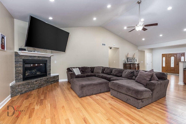 1661 Locust Rd, Morris, IL 60450 - living room featuring lofted ceiling, ceiling fan, wood finished floors, a stone fireplace, and recessed lighting