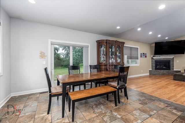 1661 Locust Rd, Morris, IL 60450 - dining space with stone tile flooring, a stone fireplace, and recessed lighting