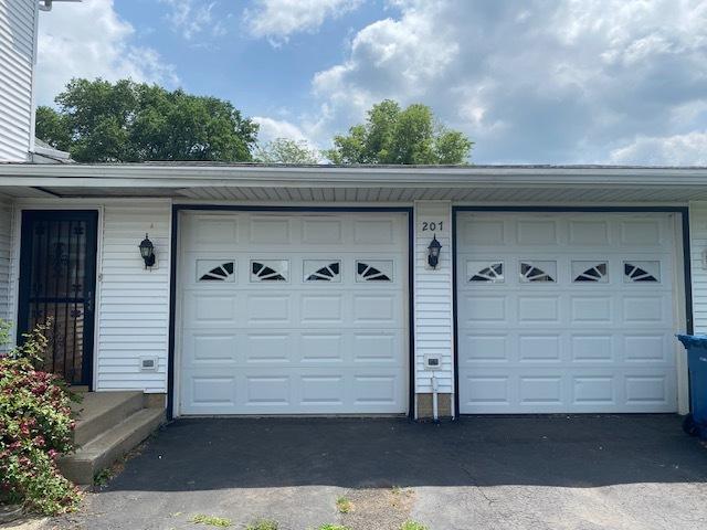 207 N Putnam St, Lostant, IL 61334 - garage with asphalt driveway