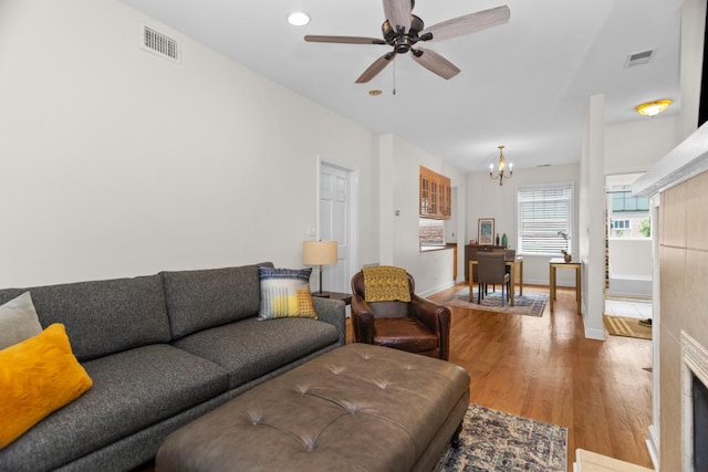 555 Elmwood Ave Unit 1, Evanston, IL 60202 - living area with a chandelier, wood finished floors, a ceiling fan, and recessed lighting