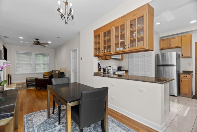 555 Elmwood Ave Unit 1, Evanston, IL 60202 - dining room with ceiling fan, recessed lighting, and a chandelier