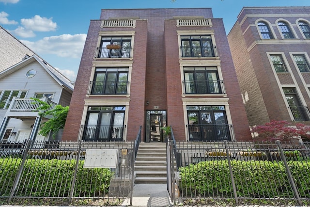 949 W Montana St Unit 3W, Chicago, IL 60614 - multi unit property with a fenced front yard and brick siding
