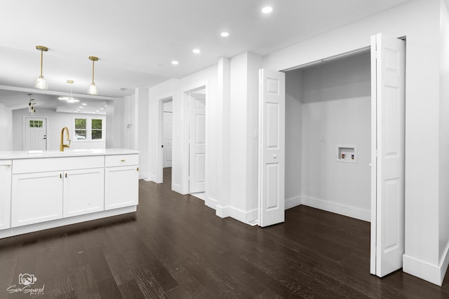 7227 S Paulina St, Chicago, IL 60636 - kitchen with recessed lighting, dark wood-style floors, light countertops, white cabinetry, and hanging light fixtures
