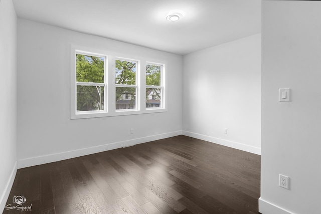 7227 S Paulina St, Chicago, IL 60636 - empty room with baseboards and dark wood-type flooring
