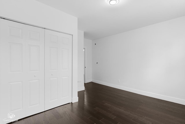 7227 S Paulina St, Chicago, IL 60636 - unfurnished bedroom featuring dark wood-type flooring and a closet