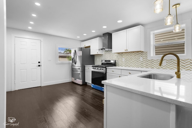 7227 S Paulina St, Chicago, IL 60636 - kitchen featuring appliances with stainless steel finishes, wall chimney range hood, light stone counters, decorative backsplash, and white cabinetry