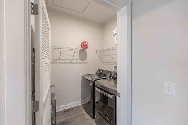 2107 Traemore Ln, New Lenox, IL 60451 - laundry area featuring washing machine and dryer, wood finished floors, and attic access
