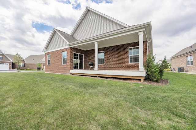 2107 Traemore Ln, New Lenox, IL 60451 - rear view of property with a lawn and brick siding