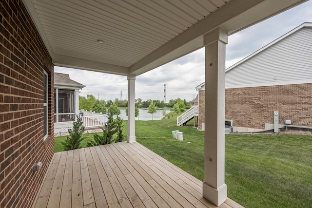 2107 Traemore Ln, New Lenox, IL 60451 - wooden terrace featuring a water view, a lawn, and a sunroom