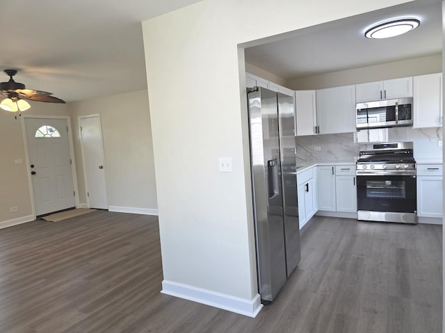 1449 Kristan Ave, North Chicago, IL 60064 - kitchen with appliances with stainless steel finishes, wood finished floors, light countertops, ceiling fan, and backsplash