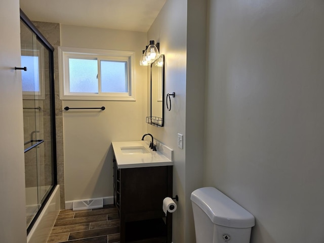1449 Kristan Ave, North Chicago, IL 60064 - full bath with vanity, wood finish floors, and combined bath / shower with glass door