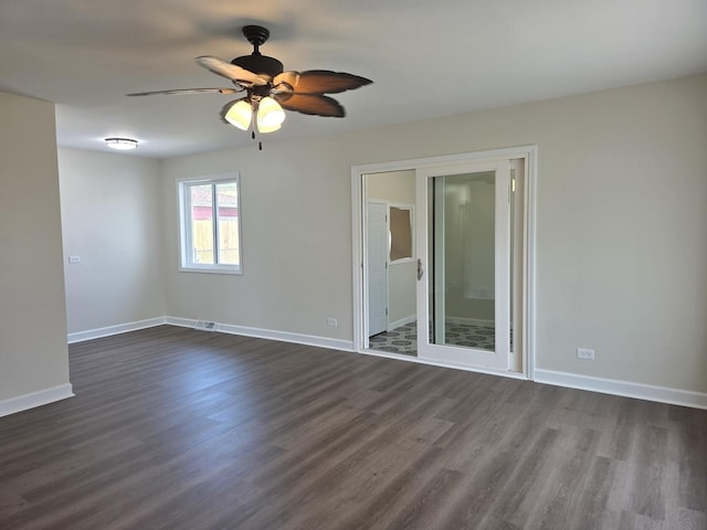 1449 Kristan Ave, North Chicago, IL 60064 - empty room featuring dark wood-style flooring and a ceiling fan